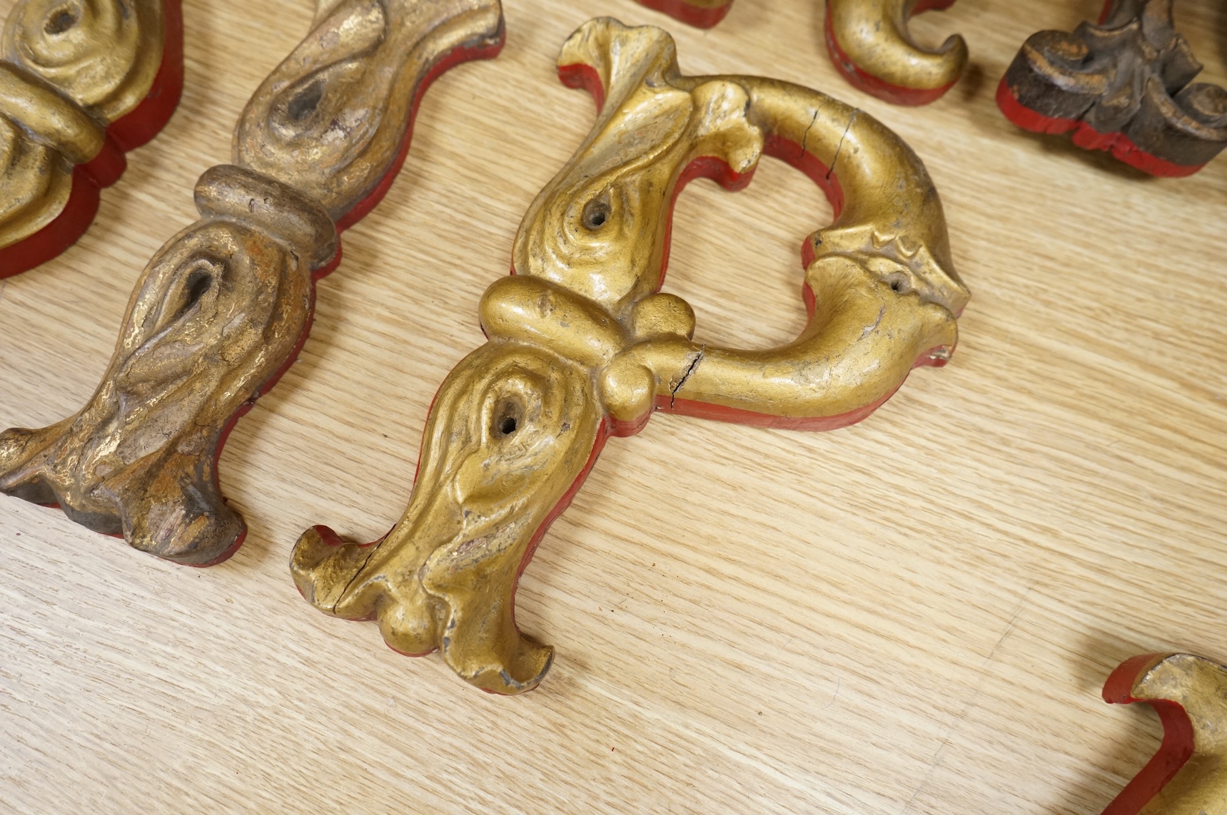 A quantity of decorative carved, painted and gilt carnival letters, each approximately 23cm high